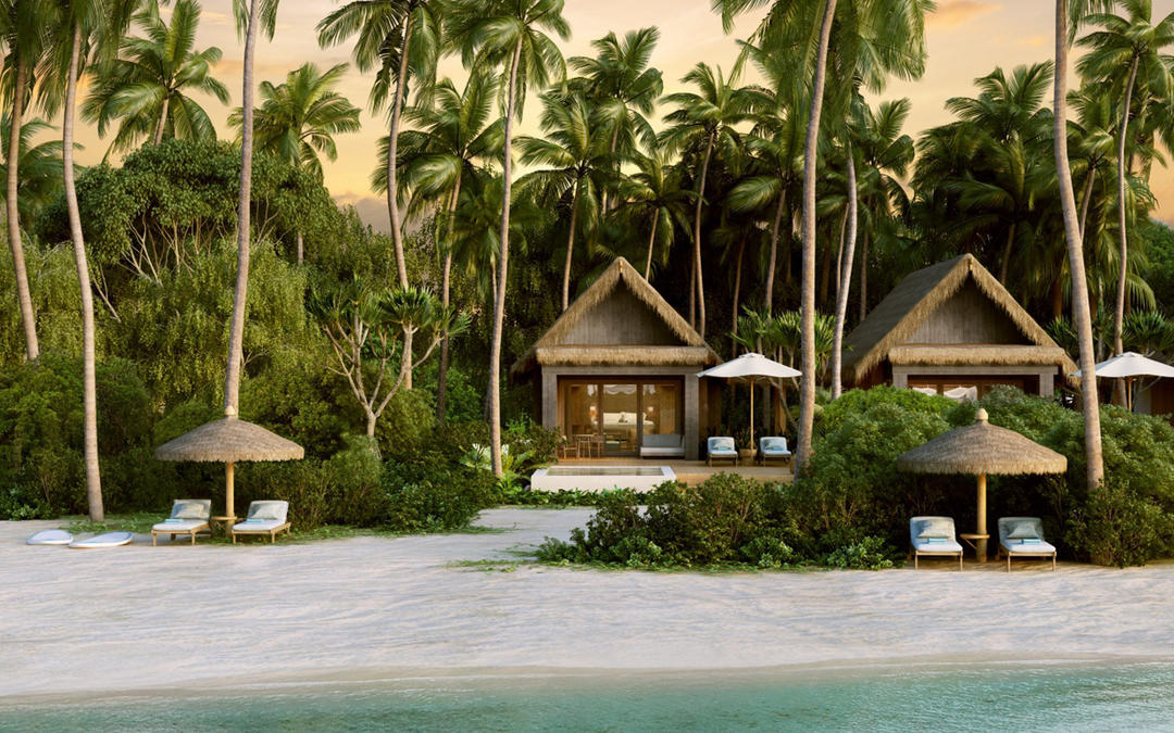 Будиночки на пляжі серед пальм